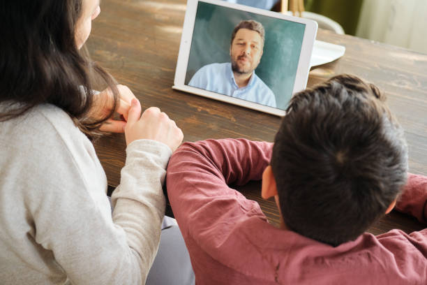 Happy family talking within video call on digital tablet